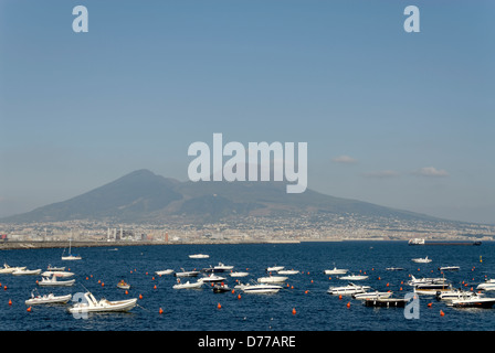 Naples. Italy. View of boats anchored on the Bay of Naples with the unmistakable profile of Mount Vesuvius in the background. V Stock Photo
