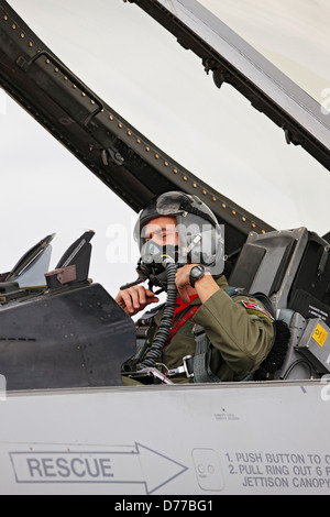 An Air Force pilot in the cockpit of a taxiing F-22 Raptor on the ...