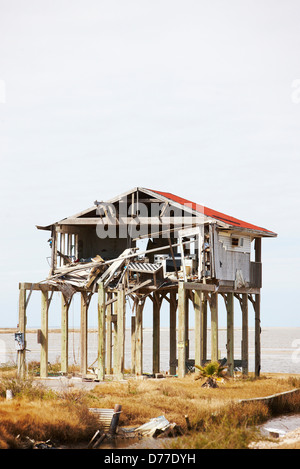 Destroyed house elevated on pilings protection hurricane Crystal Beach Bolivar Peninsula Galveston County Texas USA Stock Photo