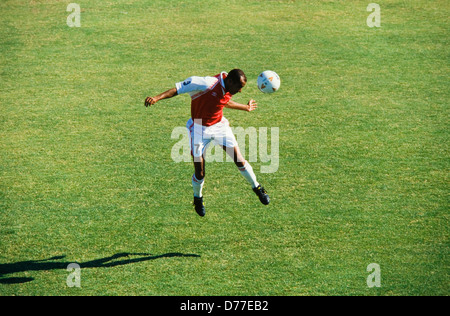 Soccer player alone with ball, shot on goal, header, , Miami Stock Photo