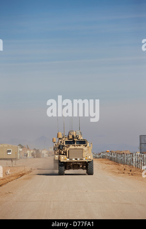 Approaching convoy United States Marine Corps MRAPs or Mine Resistant Ambush Protected Vehicle Camp Leatherneck Helmand Stock Photo