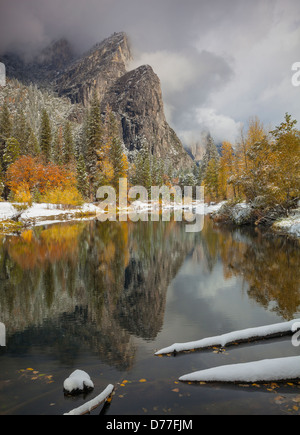 Yosemite National Park, CA: Clearing snowstorm reveals the Three Brothers reflected in the Merced River in late fall