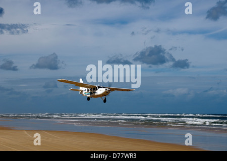 Aerial tours sightseeing plane taking off from Seventy Five Mile Beach Fraser Island Queensland Australia Stock Photo