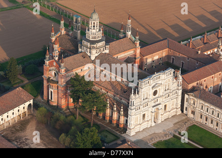 AERIAL VIEW. Carthusian monastery south of Milan, in the Po Valley. Certosa di Pavia, Province of Pavia, Lombardy, Italy. Stock Photo