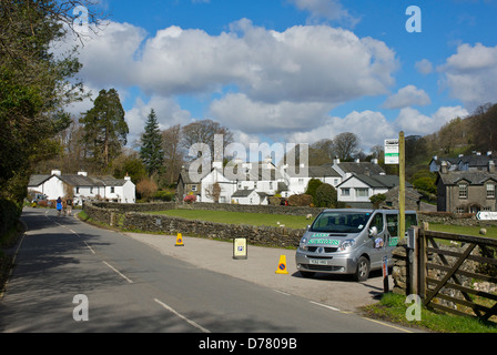 Tour bus parked near Hill Top (home of Beatrix Potter) in Near Sawrey, Lake District National Park, Cumbria, England UK Stock Photo