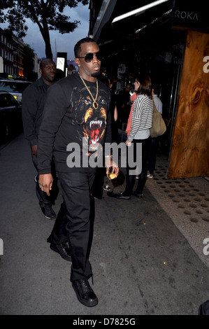 Sean Combs aka P. Diddy arriving at Roka restaurant on Charlotte Street carrying a glass of white wine London, England - Stock Photo