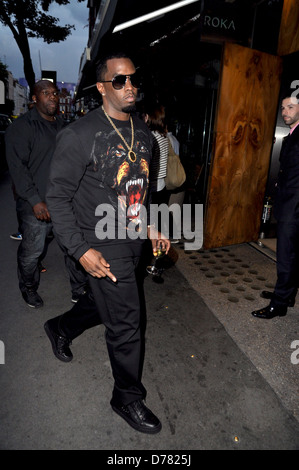 Sean Combs aka P. Diddy arriving at Roka restaurant on Charlotte Street carrying a glass of white wine London, England - Stock Photo