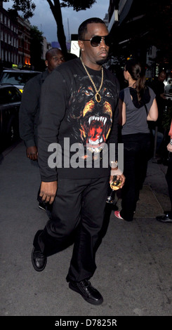 Sean Combs aka P. Diddy arriving at Roka restaurant on Charlotte Street carrying a glass of white wine London, England - Stock Photo