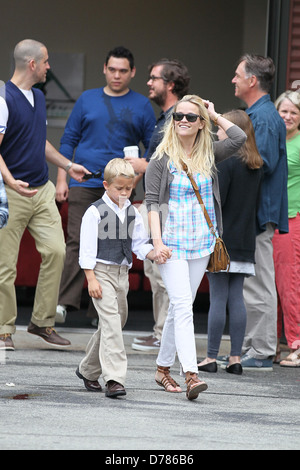 Reese Witherspoon, her son Deacon Phillippe and husband Jim Toth attend church services on Father's Day in Santa Monica Los Stock Photo
