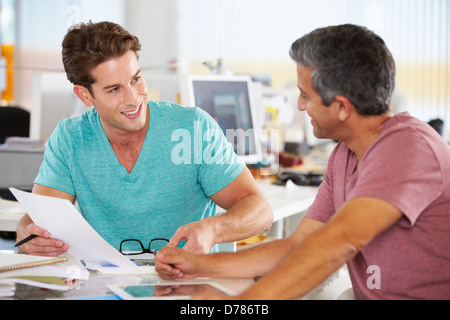 Two Men Meeting In Creative Office Stock Photo