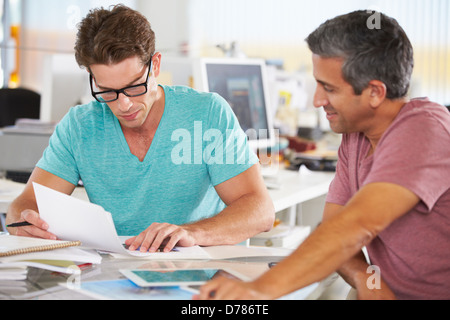 Two Men Meeting In Creative Office Stock Photo