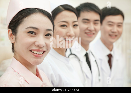 Healthcare workers standing in a row, China Stock Photo