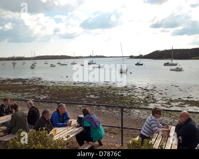 The beer garden of the Crown and Anchor pub in Dell Quay,looking out on Chichester Harbor Stock Photo