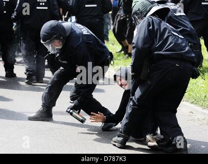 Berlin, Germany, 01 May 2013.Police officers arrest a demonstrator during a rally of the German far-right party NPD in the Schoeneweide district of Berlin, Germany, 01 May 2013. Photo: KAY NIETFELD/DPA/Alamy Live News Stock Photo