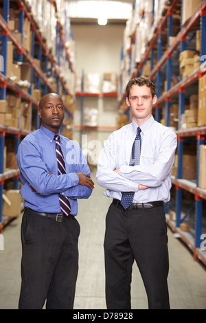 Portrait Of Two Businessmen In Warehouse Stock Photo