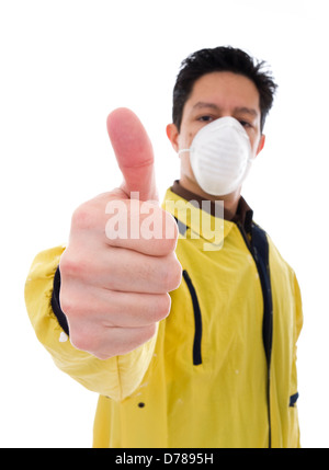 Worker with face mask giving the thumb-up sign Stock Photo