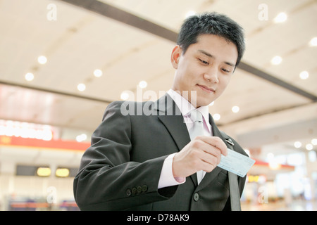 Businessman Checking the Ticket Stock Photo