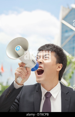Mid Adult Businessman with Megaphone Stock Photo
