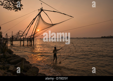 Chinese fish nets at sunset in Fort Cochin (Kochi) in Kerala, India Stock Photo