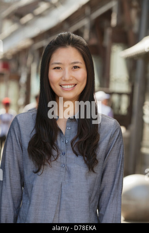 Portrait of smiling young women outdoors, Beijing Stock Photo