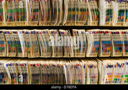 Shelves filled with colorfully labeled medical files Stock Photo - Alamy