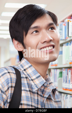 Young Man in Library Stock Photo