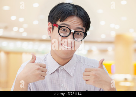 Nerdy Man Giving Thumbs Up Stock Photo