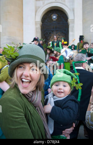 Mother and child  baby out together laughing bonding. Oxford, UK. 1st May 2013.  Revellers a young mother and son dressed in green celebrate May Day  Credit:  Homer Sykes / Alamy Live News Stock Photo