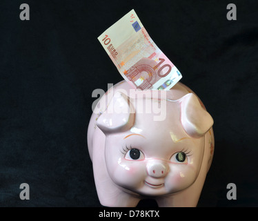 money box pig with 100 euro note number 3299 Stock Photo