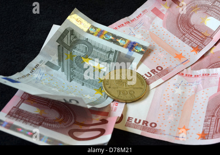 one hundred drachmes coin with euro notes number 3300 Stock Photo