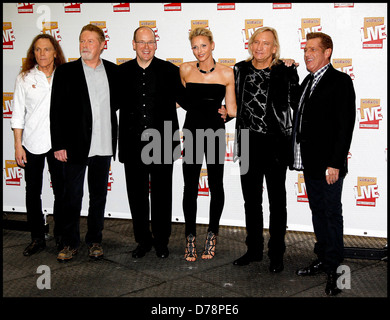 Prince Albert of Monaco and his fiancee Charlene Wittstock pose with The Eagles before their concert at Stade Louis II Stadium Stock Photo
