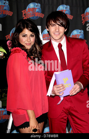 Daniella Monet and Drake Bell appear at Planet Hollywood to promote the new Nickelodeon live-action TV movie 'A Fairly Odd Stock Photo