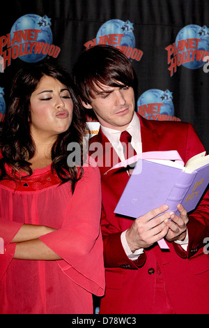 Daniella Monet and Drake Bell appear at Planet Hollywood to promote the new Nickelodeon live-action TV movie 'A Fairly Odd Stock Photo