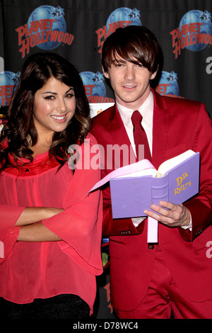 Daniella Monet and Drake Bell appear at Planet Hollywood to promote the new Nickelodeon live-action TV movie 'A Fairly Odd Stock Photo