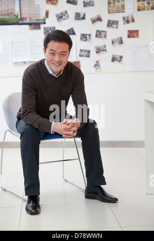 Businessman sitting in the office, portrait Stock Photo