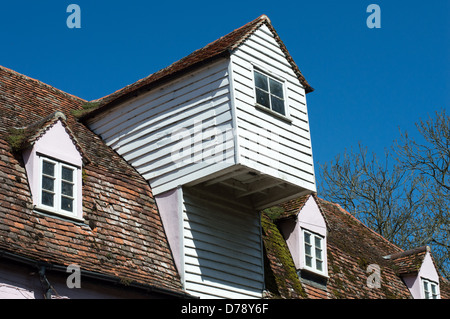 The weatherboarded hoist (viewed from outside) of an old mill building. Stock Photo