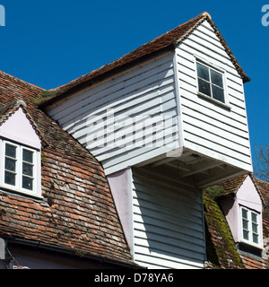 The weatherboarded hoist (viewed from outside) of an old mill building. Stock Photo