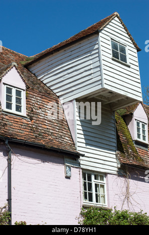 The weatherboarded hoist (viewed from outside) of an old mill building. Stock Photo