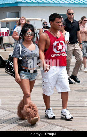 Nicole Polizzi aka Snooki and Jionni LaValle Nicole Polizzi aka Snooki draws a large crowd as she walks along the boardwalk Stock Photo