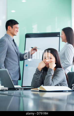 Bored Businesswoman in a Meeting Stock Photo