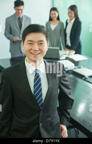 Businessman in Board Room Stock Photo