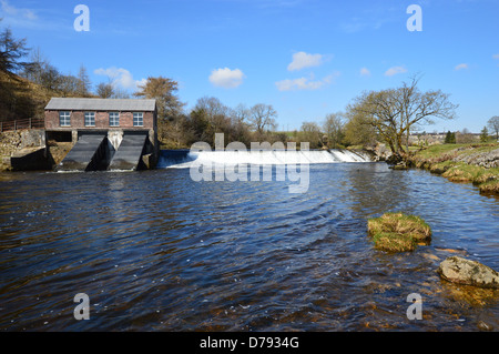 Hydroelectric Station by weir near Grassington on the River Wharfe by the Dales Way Long Distance Footpath Wharfedale Yorkshire Stock Photo