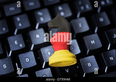 Jumper in German national colours on computer keyboard, symbolic photo federal Trojan , Springer in deutschen Nationalfarben auf Stock Photo