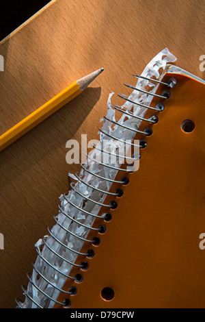 Pencil & Used Notebook On Desk Stock Photo
