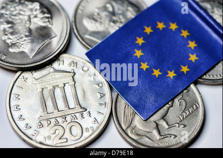 Greek drachm and EU flag, euro-climbing out of Greece , Griechische Drachme und EU-Fahne, Euro-Ausstieg Griechenlands Stock Photo