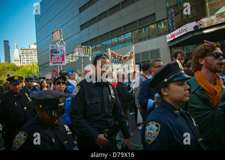 Wednesday, May 1, 2013, New York, NY, US:  Members of the New York Police Department walk alongside workers' rights demonstrators as they march down Broadway towards City Hall after a rally in New York's Union Square to mark International Workers' Day, also known as May Day.