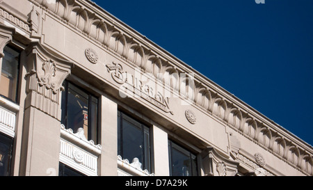 Stone carved logo, Montague Burton tailor Stock Photo