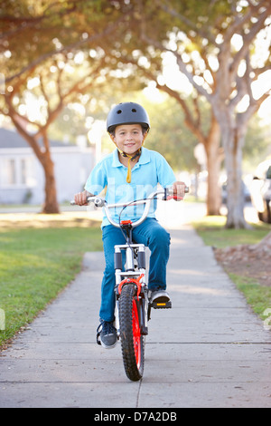 Boy Wearing Safety Helmet Riding Bike Stock Photo