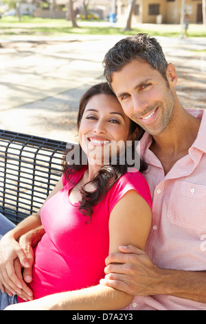 Loving and romantic couple on a bench in the autumn park Stock Photo ...