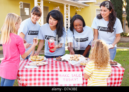 Women And Children Running Charity Bake Sale Stock Photo